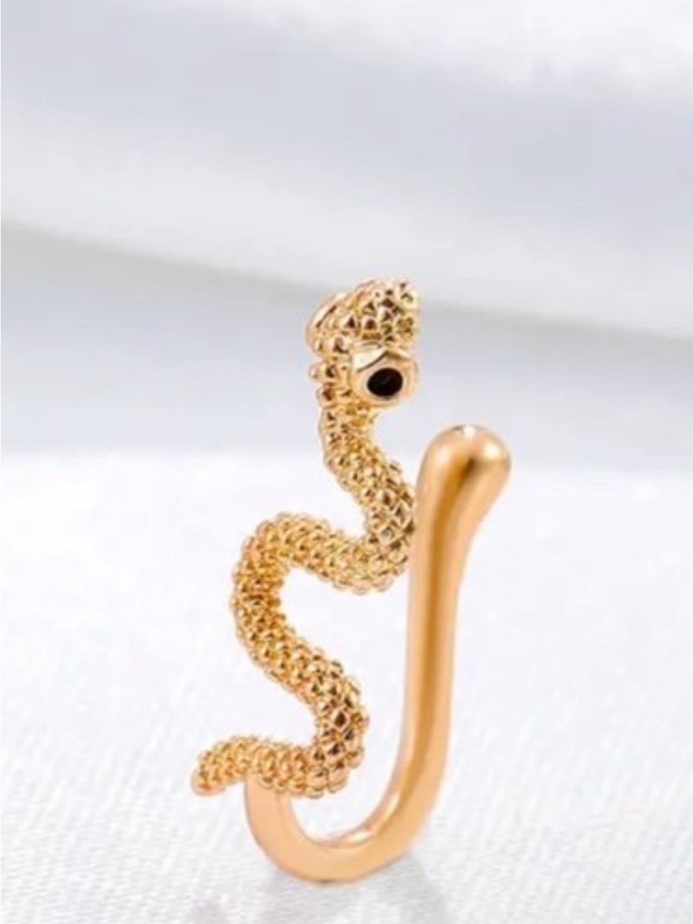 New in package, goldtone snake nose ring, no piercing required, super cute